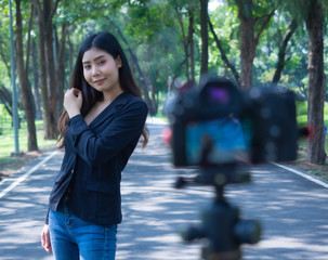 happy asia business woman wearing suit take photo  selfie together in park copy space