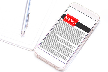 Online news on a mobile phone. Close up of smartphone screen with news feed on a white table. Mock up site. Newspaper