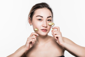 Obraz na płótnie Canvas Beauty asian girl using skin anti aging needles roller. Close up portrait smiling cute beautiful woman, showing mezo-roller, for clean skin fresh face, 