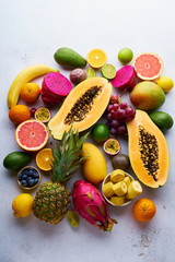 Flat lay with variety of fresh tropical fruits