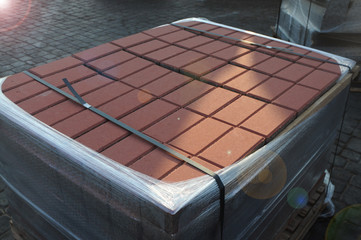 Paving stones, cement bricks, pavement, pallets

