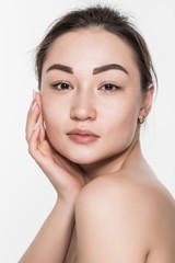 Fototapeta premium Beautiful face of a young woman with clean fresh skin isolated on white background. Skincare and body care concept.