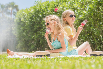 Portrait of a cute girl with ice cream. Summertime fun.