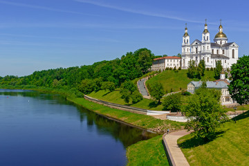 Fototapeta na wymiar Vitebsk embankment of the Western Dvina river and view of St. George's Church, Vitebsk, Belarus