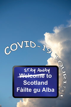 Welcome To Scotland Sign With Stay Away Pandemic Tourist Message Following Relaxation Of Travel Restrictions By UK Government, Sign In English And Gallic Languages 