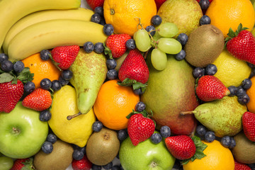 Assortment of healthy raw fruits. Food concept background