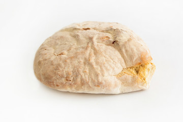 Crunchy homemade wheat bread cooking at home kitchen. Fresh white loaf isolated on white background. Studio shot. Front view. Cooking and baking at home concept