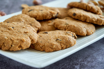 Close up on a bunch of peanut butter cookies in white plate healthy and natural homemade peanut butter gluten-free cookies
