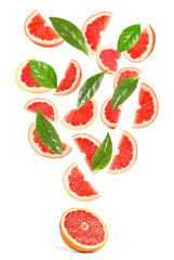 Slices of juicy grapefruit and leaves on white background