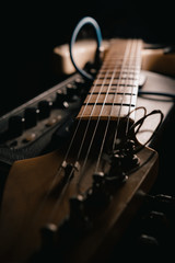 The Guitar and Amplifier Closeup detail in the dark background 