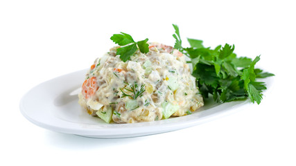 The vinaigrette of various boiled vegetables withe parsley on the plate