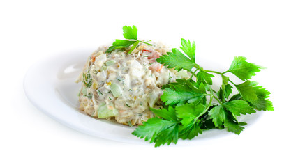 The vinaigrette of various boiled vegetables withe parsley on the plate