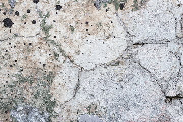 Old stone wall with cracks and dust, textured background