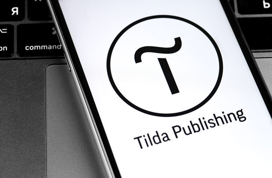 Tilda Publishing logo on the screen smartphone closeup. Tilda Publishing - Block Website Builder. Moscow, Russia - March 24, 2020