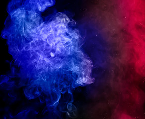 red and blue colorful smoke on dark background