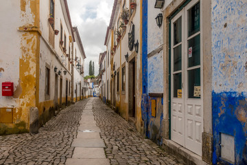 Street views, castle walls and churches of Obidos, Portugal.