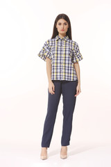 Obraz premium Indian business woman executive posing in checkered blouse blue trousers full body
