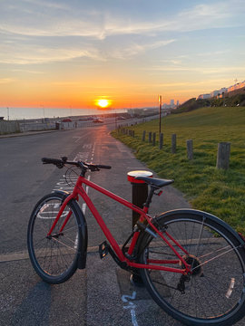 Cycling bike by the beach at sunset in summer time