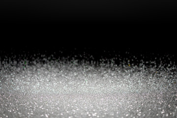 Abstract silver glitter background. Holiday shiny texture.