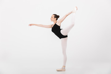 Image of caucasian woman ballerina practicing and dancing gracefully