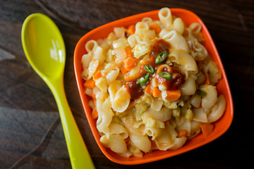 Indian style of pasta with veggies and sauce on table top
