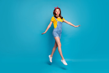 Full length body size view of her she nice attractive trendy girl jumping walking having fun strolling free time isolated on bright vivid shine vibrant blue green teal turquoise color background