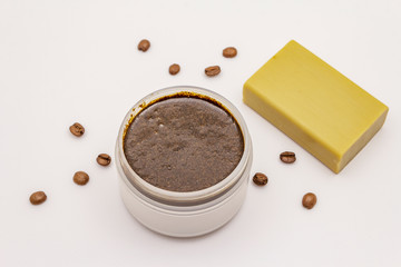 Coffee body scrub and soap isolated on white background. Spa concept, homemade cosmetics from natural ingredient