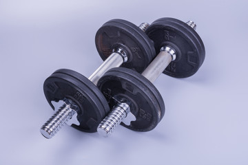 two athletic dumbbells for weightlifting