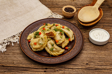 Dumplings stuffed stewed cabbage and sour cream. Traditional Ukrainian dish varenyky
