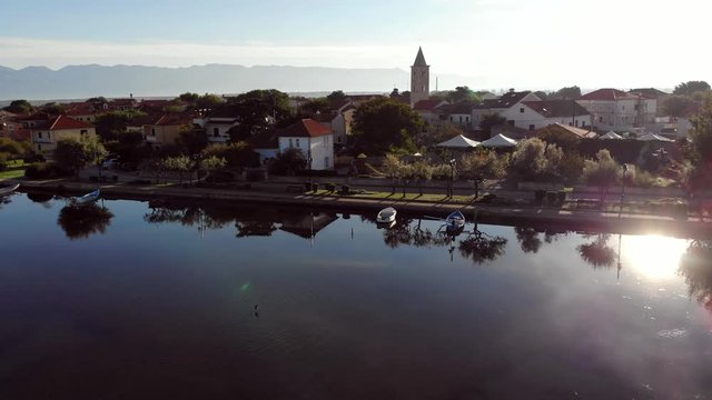 Morning Flight Over Lagoon And Houses Of European Town (Nin, Croatia)