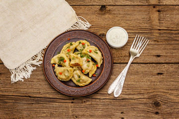 Dumplings stuffed stewed cabbage and sour cream. Traditional Ukrainian dish varenyky