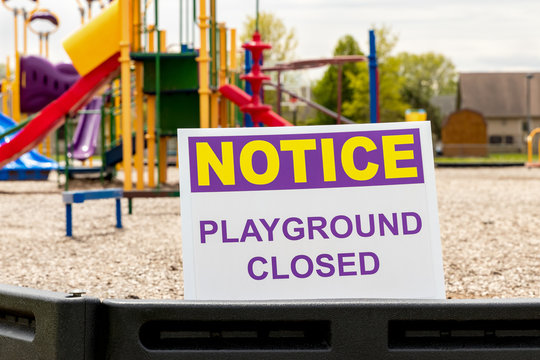 Playground closed sign due to social distancing, lockdown restrictions during Covid-19 coronavirus pandemic