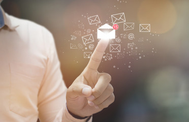 Businessman pressing open email icon on virtual touch screen