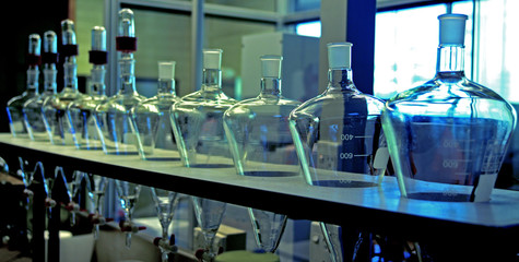 series of glass laboratory flasks