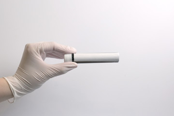 The concept of medicine. Medical gloves. Isolated. Close-up. Copy space.Medical test tube.