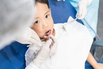 A boy having teeth examined at dentists: Healthy lifestyle, healthcare, and medicine concept.