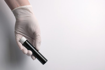 The concept of medicine. Medical gloves. Isolated. Close-up. Copy space.Medical test tube.