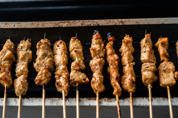 grilled chicken skewers or sate on the grill