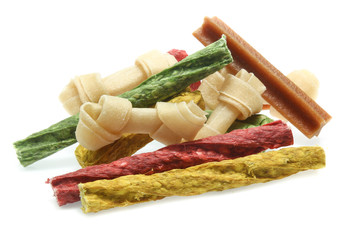 bones and colorful sticks for dog treat with vitamin and oral health on white background