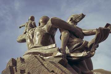 a huge monument on Africa's independence mountain with a view of the city photographed from the throne