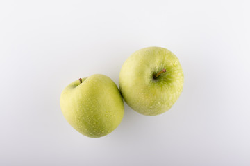 Ripe yellow apple variety golden on a white background