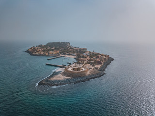 the island gore from which slaves were exported from Africa, turquoise water and yellow sand photographed from the air
