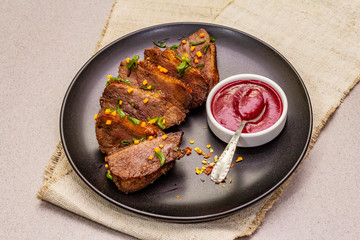 Roast and braised duck breast with sweet and sour berry sauce