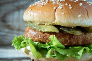 vegetarian Burgerr with lettuce, cutlet and cucumbers closeup