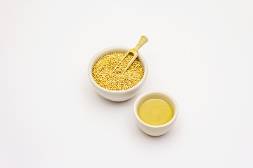 Tahini with sesame seeds isolated on white background