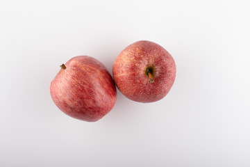 Ripe red apple on a white background