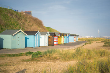 Fototapeta na wymiar Colourful beach huts, South Beach in Lowesoft, Norfolk, UK