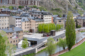 Fototapeta premium Cityscape of Canillo, Andorra in spring with the church in the background and the Palau del Gel on a sunny day.