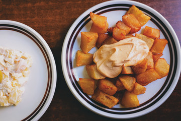 friend homemade Spanish potatoes with homemade mayonnaise. Delicious fried food and feel good food. traditional recipes and cooking from home. Grandma's cooking. 