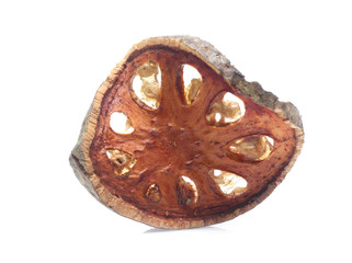 Dry bael fruit on white background